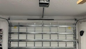 Inside face of a closed metal sectional garage door